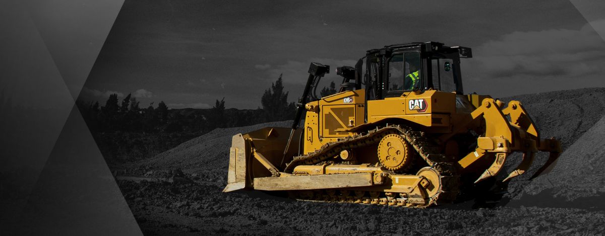 A D6 Cat dozer in color in a black-and-white setting