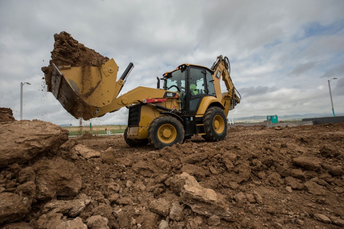 New Caterpillar Backhoe Loader in Use on Construction Site