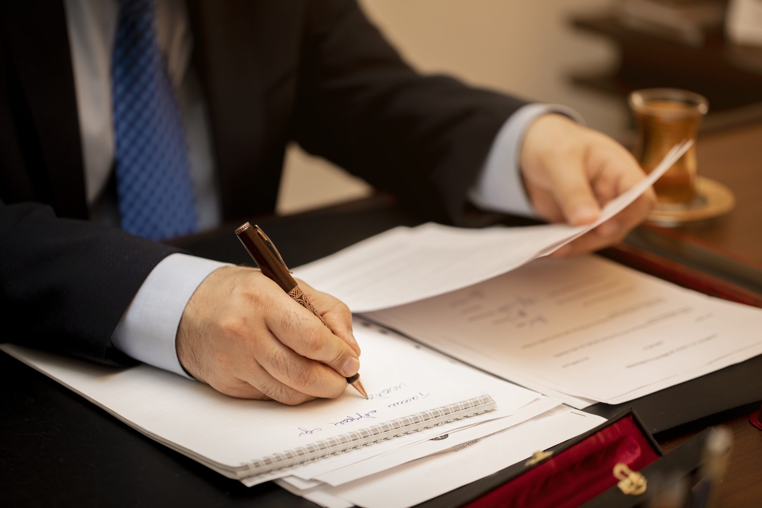 businessman-signing-important-contract-papers-scaled